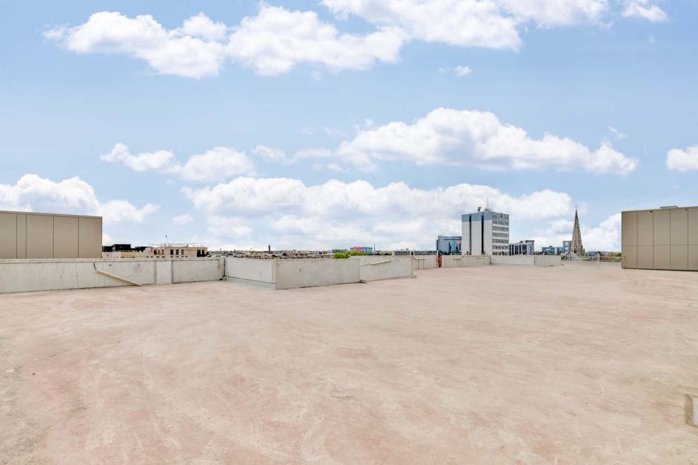 A private multi-storey car park with large roof (Brentford, London)