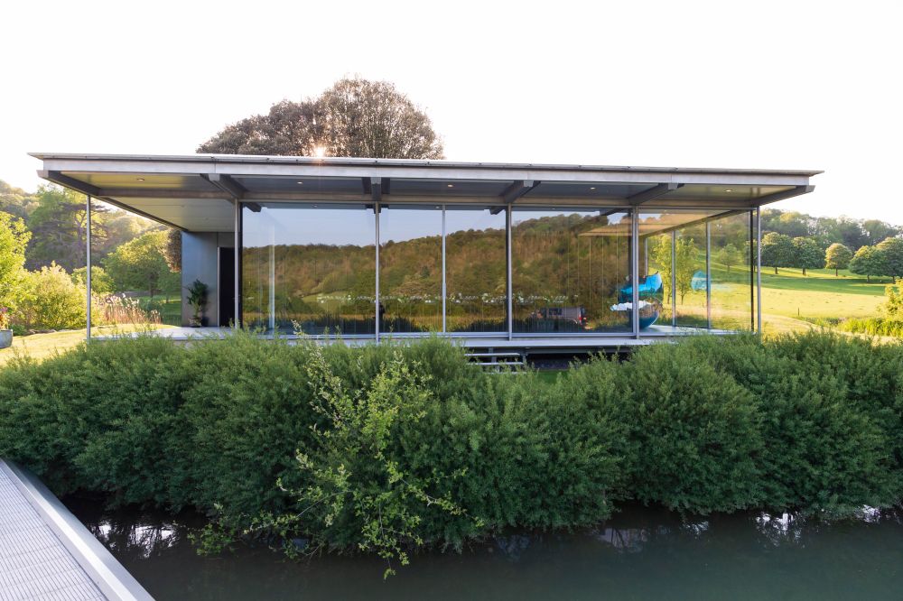 Modern Glass Pavilion set on Island in a Lake on a private country estate